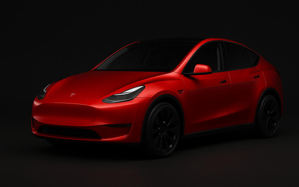 Tesla Model Y in red on dark background - claim £500 UK referral discount